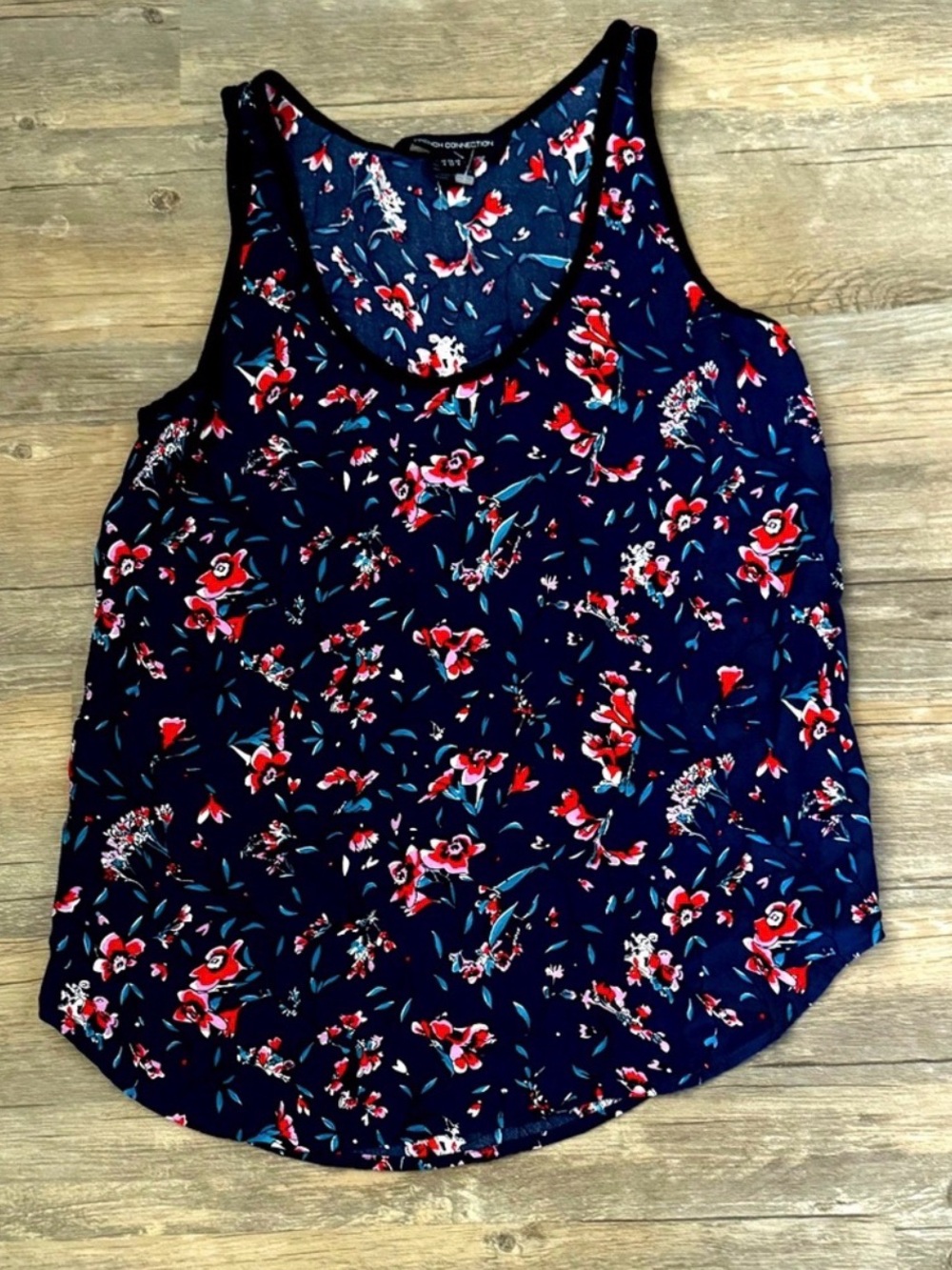 French Connection navy blue tank top featuring a vibrant floral pattern